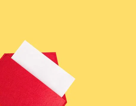 Red open envelope with a sheet of paper mock up on a yellow background with c Stock Photos