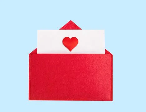 Red open envelope with a sheet of paper with a heart on a blue background wit Stock Photos