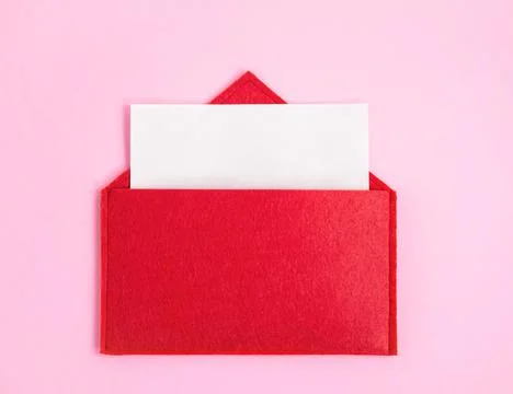 Red open envelope with a sheet of paper with mock-up  on a pink background wi Stock Photos