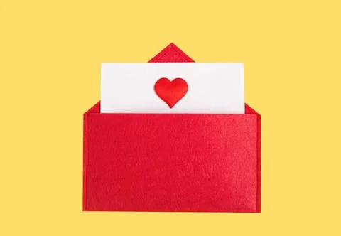Red open envelope with a sheet of paper with a heart on a yellow background w Stock Photos