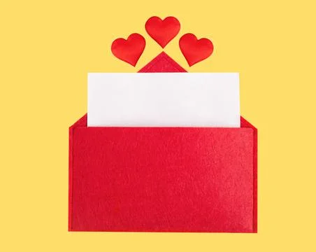 Red open envelope with a sheet of paper with a hearts on a yellow background Stock Photos