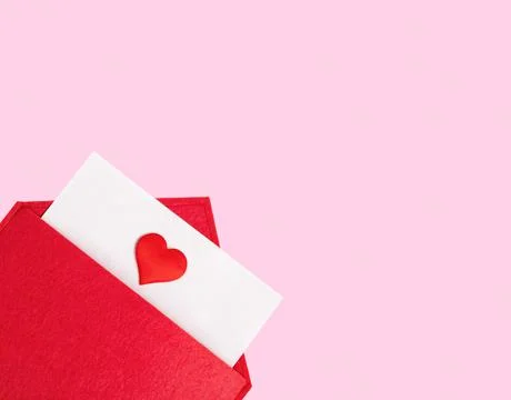 Red open envelope with a sheet of paper with a heart on a pink background wit Stock Photos