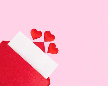 Red open envelope with a sheet of paper with a hearts on a pink background wi Stock Photos