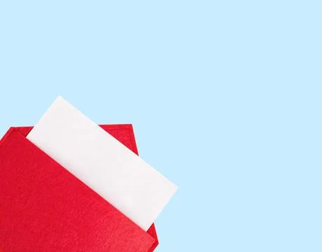 Red open envelope with a sheet of paper mock up on a blue background with cop Stock Photos