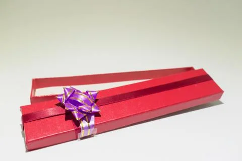 Red open gift box isolated with purple blow Stock Photos