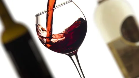 Red or rose wine pouring into glass angle shot Video stock 144570854