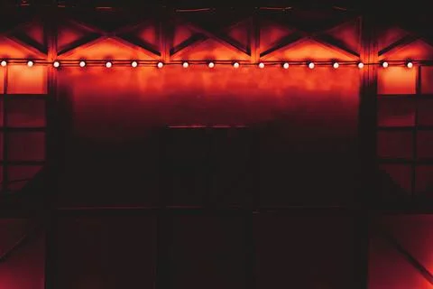 Red orange backlight.Draped glowing decorated wall Photos