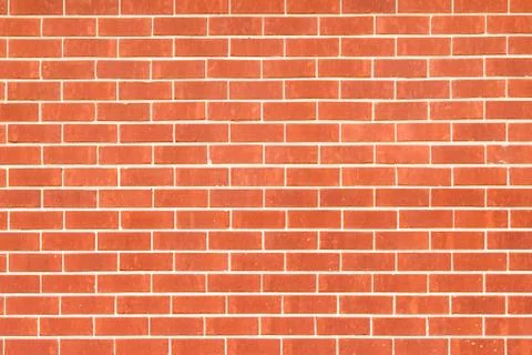 Red orange brick wall for background use. Stock Photos