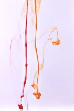 Red &amp; Orange Ink Lines Dynamic Motion in Water. Soft Ambient Background. Foto stock