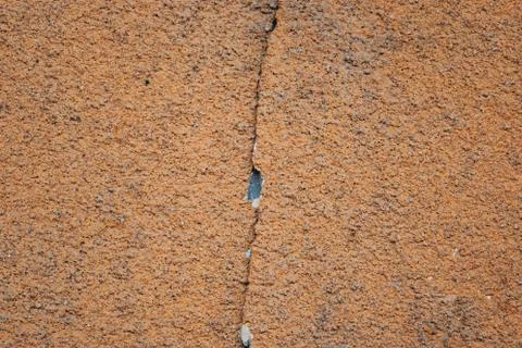 Red orange wall with cracks, texture background. Stock Photos