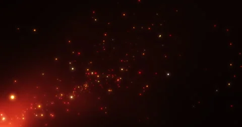 Red, orange, yellow particles flying in a beam of red light against a backgr Stock Footage 263371603