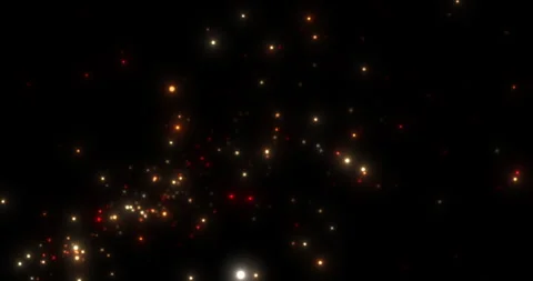 Red, orange, yellow particles scattering against the background of darkness Stock Footage 263371850