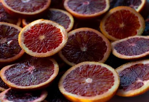 Red oranges fruit background. Sliced juicy orange. Food. Summer concept. Close Stock Photos