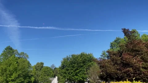 Red Orb UFO UAP alien space ship Tic Tac shape Residential Day Stock Footage 240481366