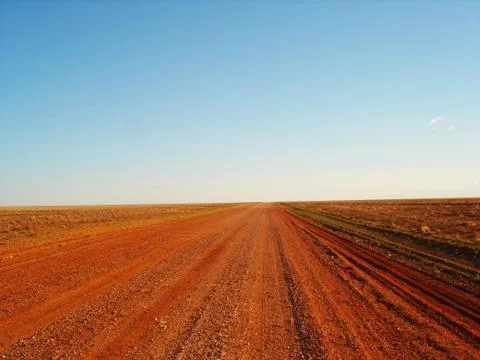 Red outback road in the middle of nowhere Stock Photos