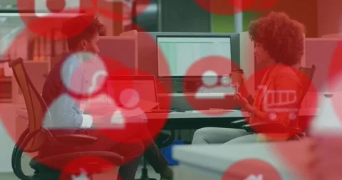 Red overlay fading as two staff checking business spreadsheet, left using Stock Footage 321161404
