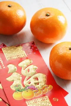 Red packets and mandarin oranges, golden Chinese letter means luck Photos