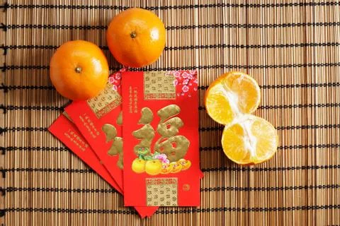 Red packets and mandarin oranges, golden Chinese letter means luck 스톡 사진