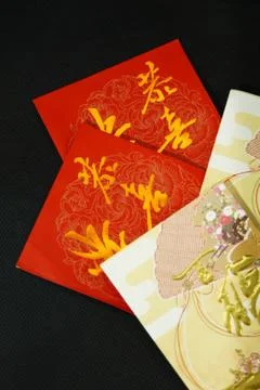 Red packets on black background Stock Photos