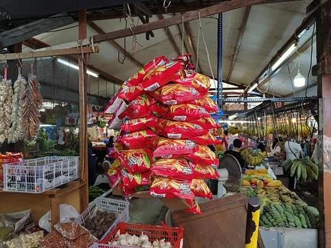 Red packets containing snacks are hung for sale Stock Photos