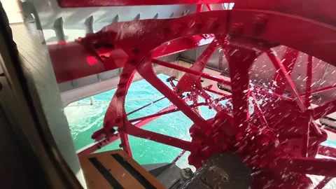 Red Paddle Wheel Spinning In Slow Motion Over Lake Lucerne, Switzerland, Europe Stock Footage 344056485