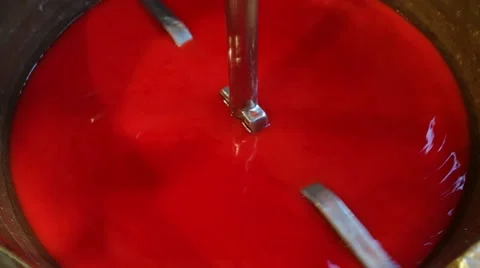Red paint being mixed in factory Vídeo Stock 68333385