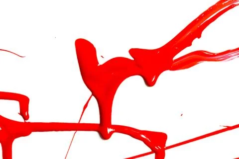 Red paint close up on a white background Stock Photos