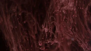 Red paint on the dark background Stock Footage 85843466