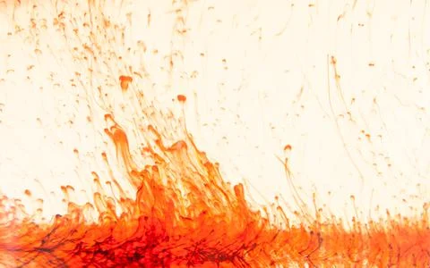 Red paint dissolves in liquid, process Stock Photos