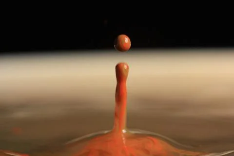 Red paint drop close up Stock Photos