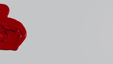 Red paint flows from the edges of the screen slowly filling the space Video stock 281113051