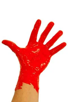 Red paint on hand Stock Photos