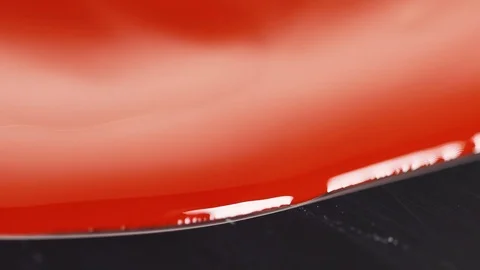 Red paint liquid texture, oil paint for painting,  art  mix color. Video stock 103177876