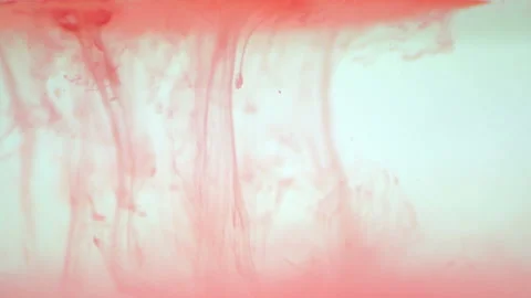 Red paint particles dropping Stock Footage 100678314