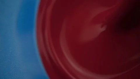 Red Paint Poured Into Blue Paint Stock Footage 94359999