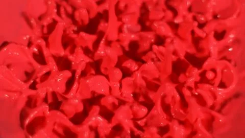 Red paint splatter background, macro texture Stock Photos