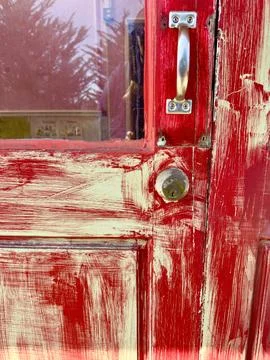 Red paint texture washed over light tone on door Photos