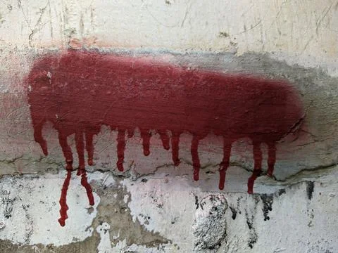 Red paint on the wall flows down Stock Photos