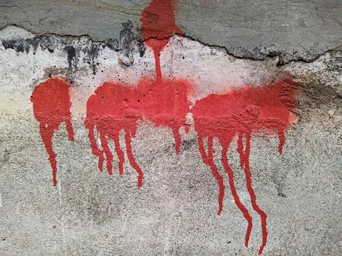 Red paint on the wall flows down Stock Photos