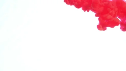 Red paint in water on a white background. Stock Footage 131947979