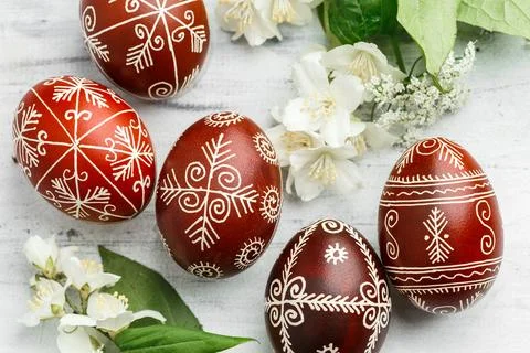 Red painted Ukrainian Easter eggs with jasmine Stock Photos