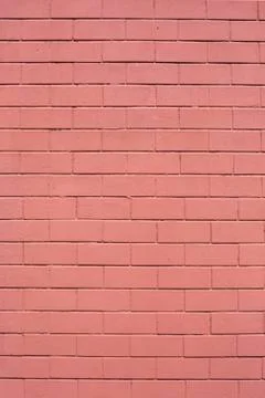 Red painted vertical stone bricks wall pattern texture background Stock Photos