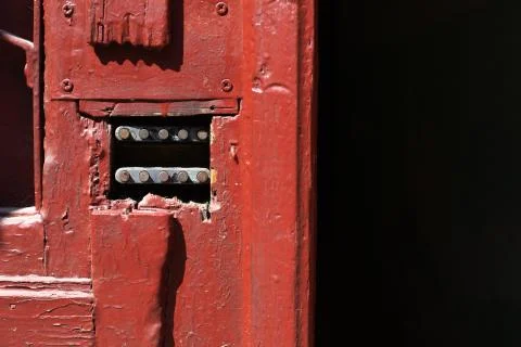 Red painted wooden door with a code lock Stockfoto's