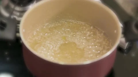 Red Pan With Bubbling Water Stock Footage 114873617