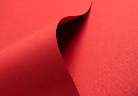 Red paper background with a matte texture and soft tones. Bold crimson and Stockfoto's