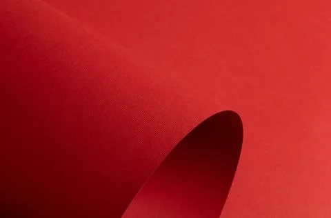 Red paper background with a matte texture and soft tones. Bold ruby and crims Stock Photos