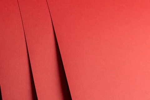 Red paper background with a matte texture. Ruby and crimson hues create a 库存照片