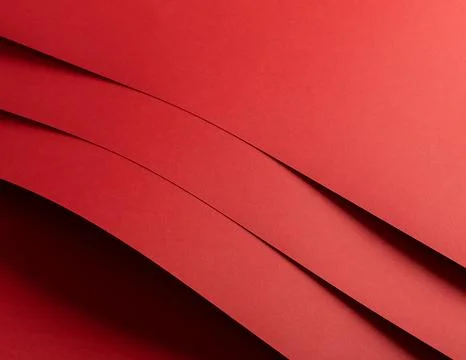 Red paper background with a matte texture and soft tones. Bold ruby and crims 库存照片