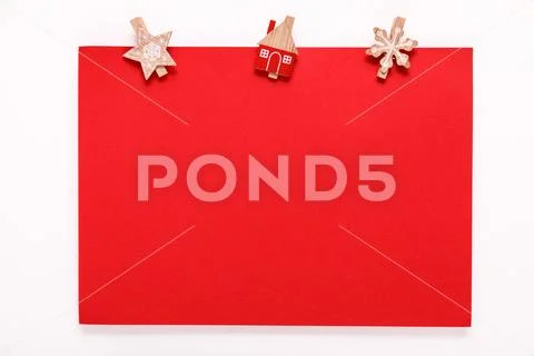 Red paper card on a christmas clothes peg Stock Photos