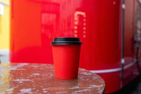 Red paper coffee cup with black plastic lid Stock Photos